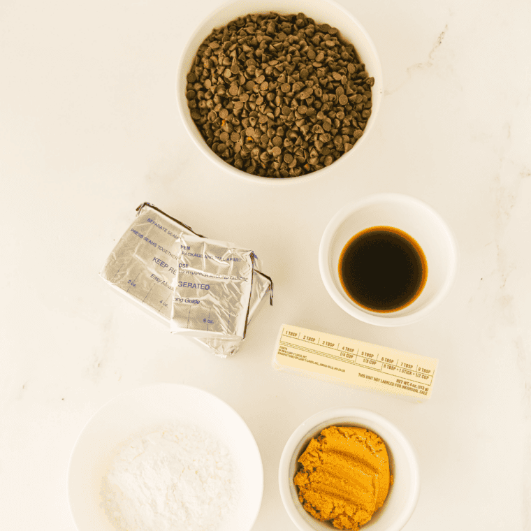 Chocolate chip cheese ball ingredients including cream cheese, butter, powdered sugar, brown sugar, vanilla, and mini chocolate chips
