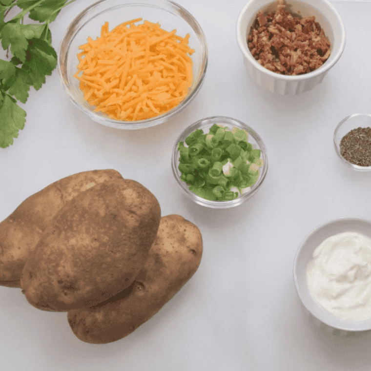 Scrubbing russet potatoes under cold water before air frying