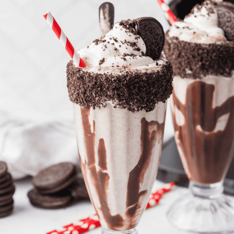 Thick Ninja Slushi Oreo milkshake in a chilled glass topped with whipped cream and crushed cookies